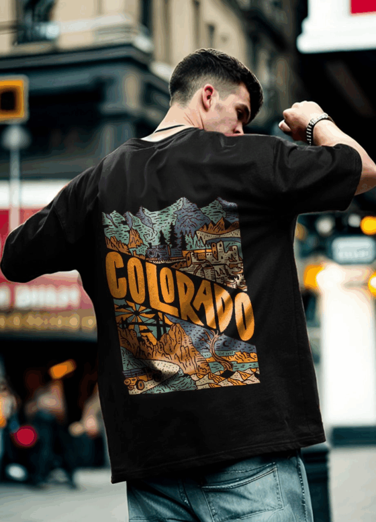 Oversized black t-shirt with a vibrant Colorado-themed graphic print on the back, showcasing a trending design style for men in 2025